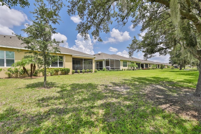 view of yard featuring a sunroom