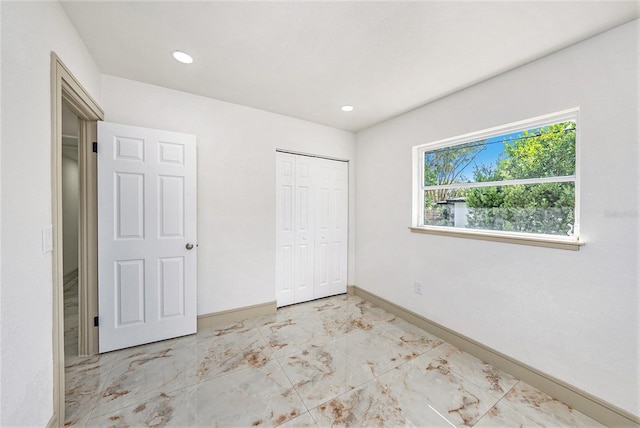 unfurnished bedroom with a closet