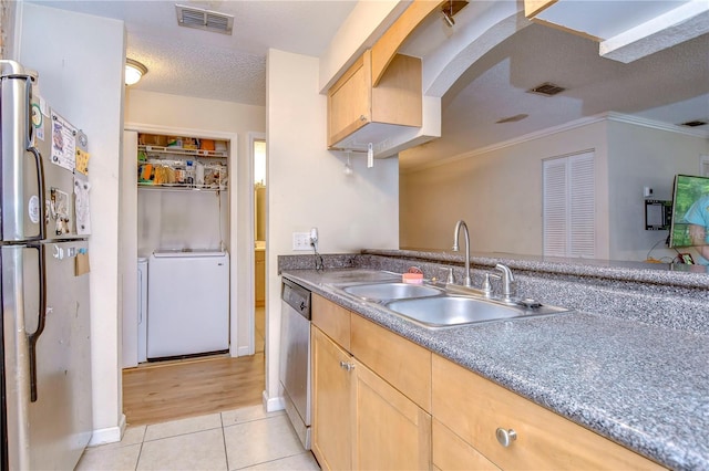 kitchen with crown molding, light hardwood / wood-style flooring, stainless steel appliances, sink, and light brown cabinets