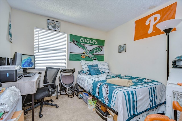 carpeted bedroom with a textured ceiling