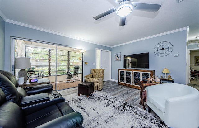 living room with ceiling fan, hardwood / wood-style floors, and crown molding