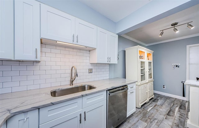 kitchen featuring light hardwood / wood-style flooring, dishwasher, and white cabinetry