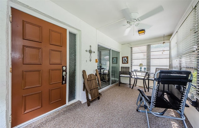 workout room with carpet flooring and ceiling fan