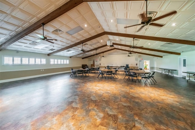 interior space featuring vaulted ceiling with beams and ceiling fan