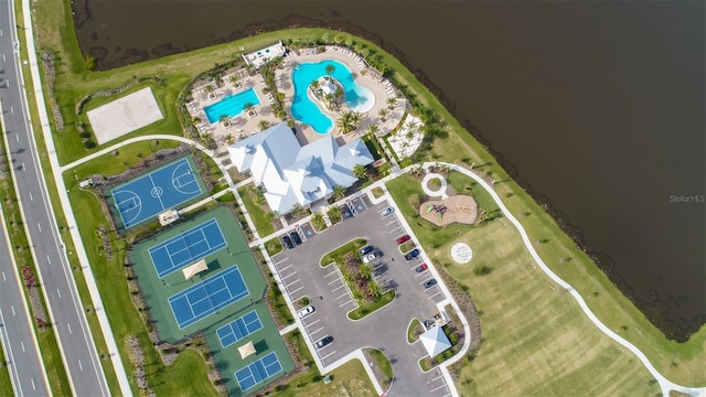 birds eye view of property with a water view