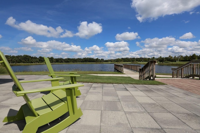 view of patio with a water view