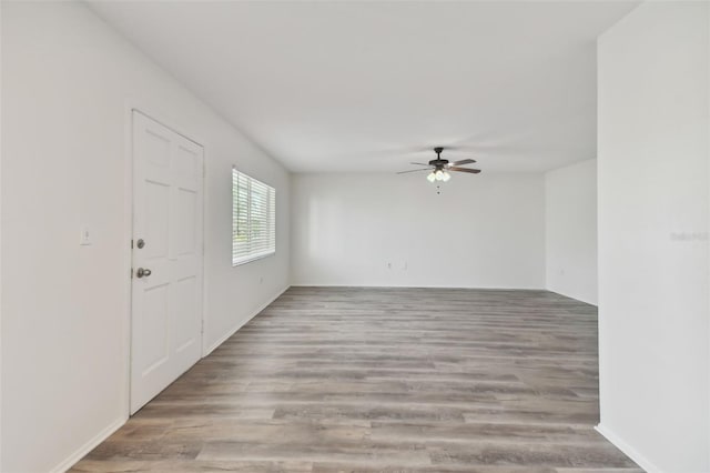 unfurnished room with light hardwood / wood-style floors and ceiling fan