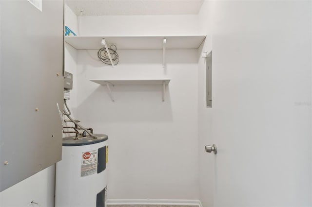 laundry room featuring water heater