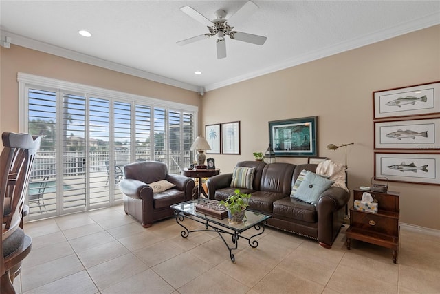 living room with ornamental molding, light tile patterned floors, and ceiling fan