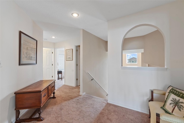 sitting room with light colored carpet