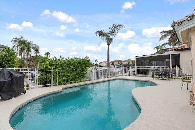 view of swimming pool with a patio area and area for grilling