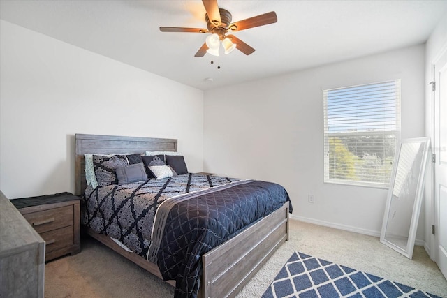 bedroom with light carpet and ceiling fan