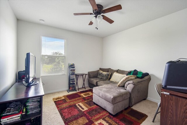 living room featuring ceiling fan and carpet floors