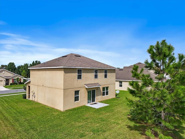 rear view of house with a yard