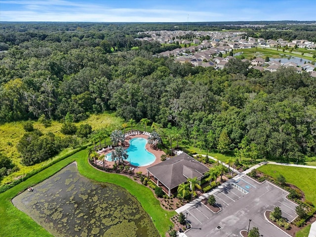 bird's eye view featuring a wooded view