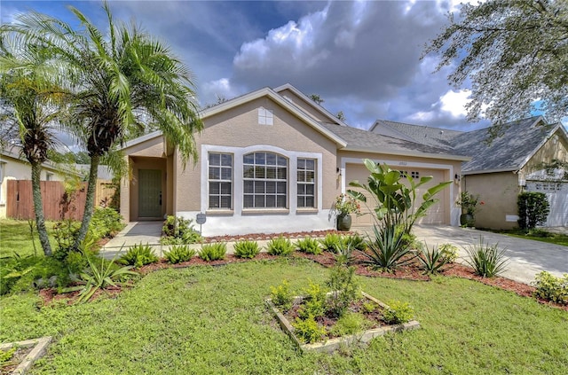 single story home with a garage and a front yard