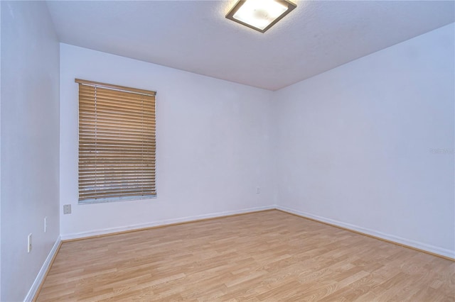 unfurnished room featuring light hardwood / wood-style floors