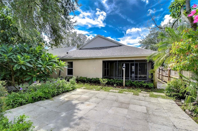 back of property featuring a sunroom