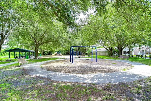 view of property's community with a playground and a gazebo