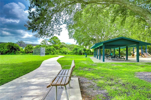 view of home's community featuring a yard and a playground