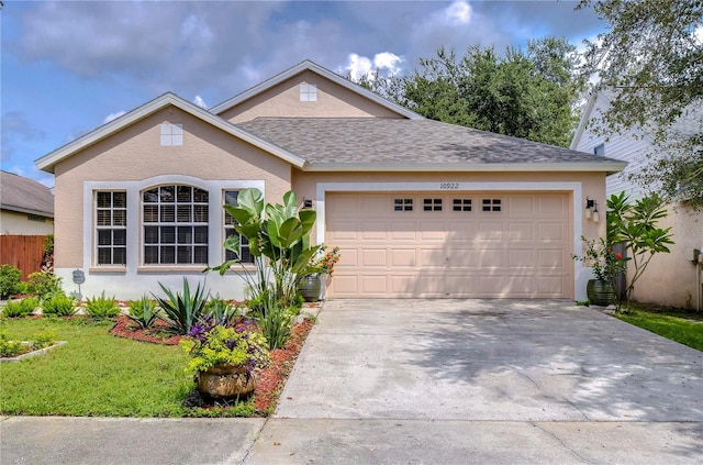 ranch-style house with a garage and a front lawn