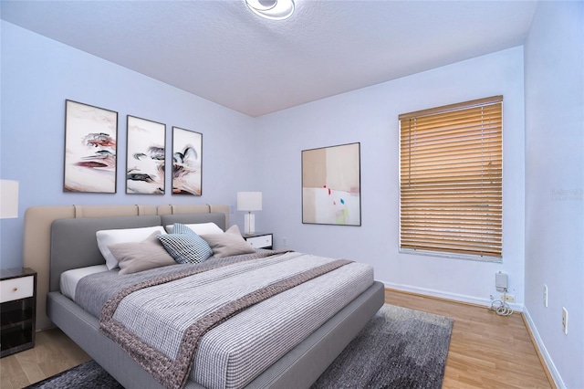 bedroom featuring light wood-type flooring