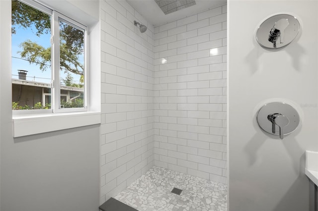 bathroom featuring tiled shower