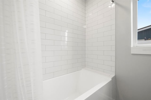 bathroom featuring shower / tub combo with curtain