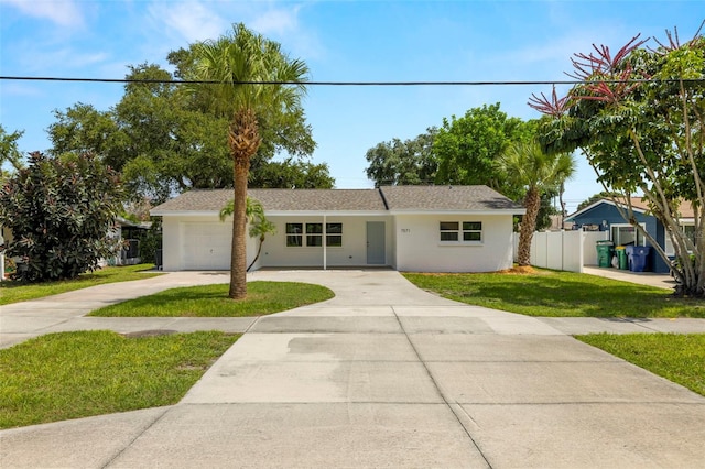 ranch-style home with a front lawn