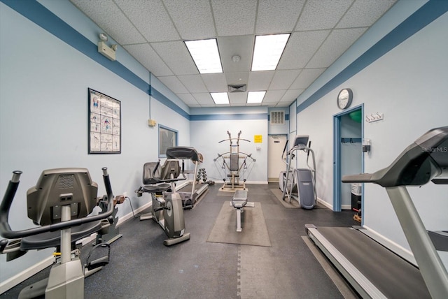 exercise room featuring a drop ceiling