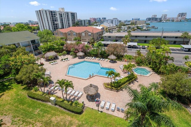 view of pool featuring a patio area and a water view