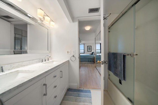 bathroom with wood-type flooring and vanity