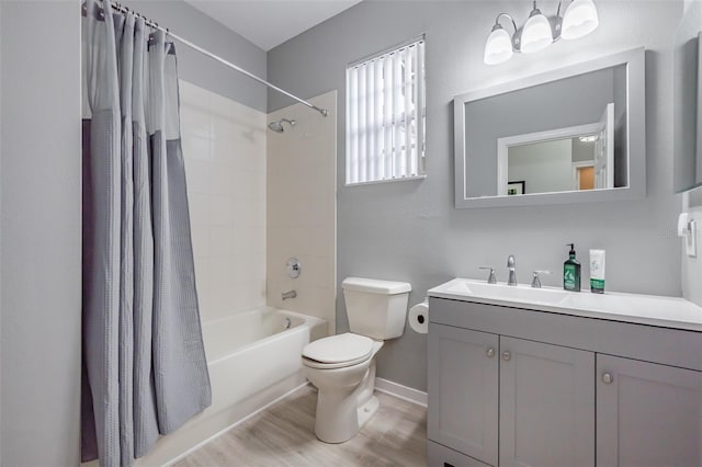 full bathroom with vanity, hardwood / wood-style floors, toilet, and shower / bathtub combination with curtain