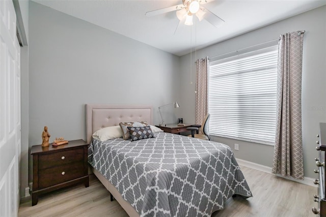 bedroom with ceiling fan and light hardwood / wood-style flooring