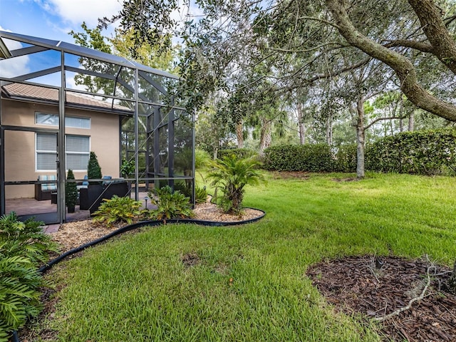 view of yard featuring a patio and glass enclosure