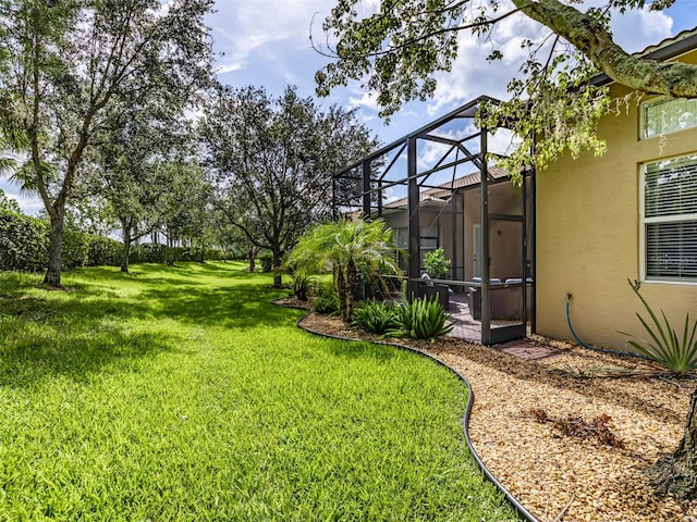 view of yard featuring glass enclosure