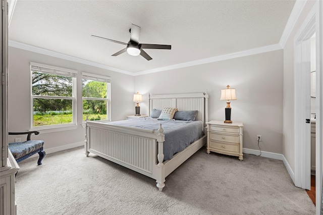 carpeted bedroom featuring a textured ceiling, ceiling fan, and ornamental molding