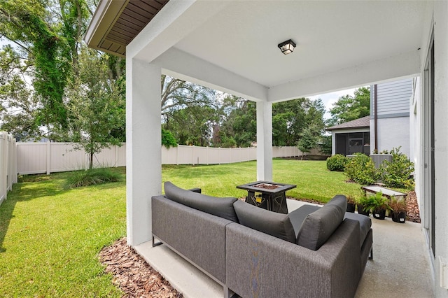 view of patio / terrace featuring an outdoor fire pit