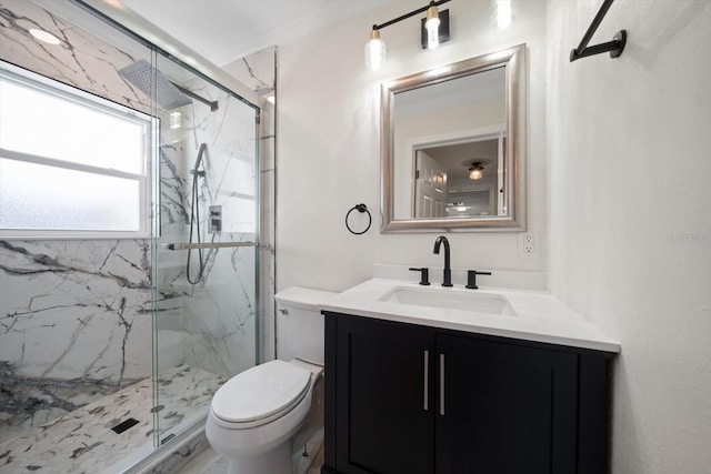 full bath featuring toilet, vanity, and a marble finish shower