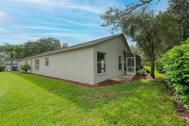 view of home's exterior featuring a lawn and stucco siding