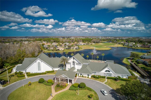 drone / aerial view featuring a water view and a residential view