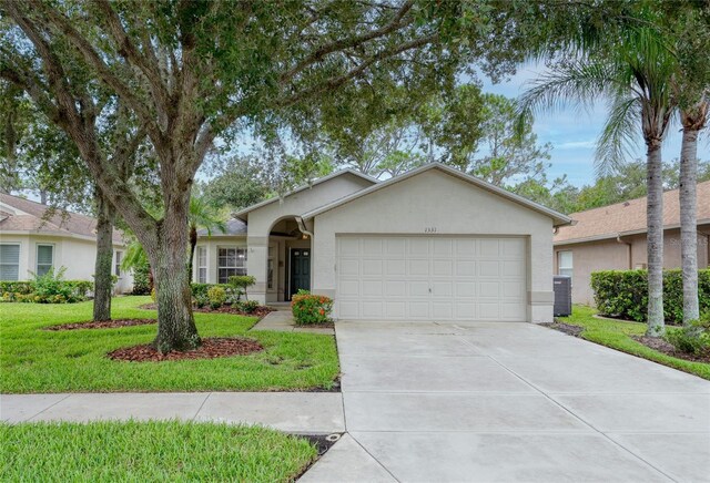 ranch-style home featuring central air condition unit, stucco siding, concrete driveway, an attached garage, and a front lawn