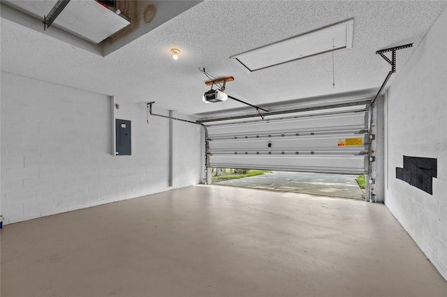 garage with a garage door opener, concrete block wall, and electric panel