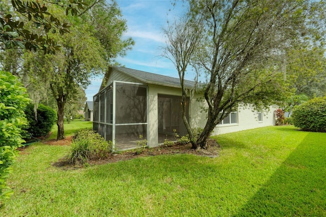 view of outdoor structure with a sunroom