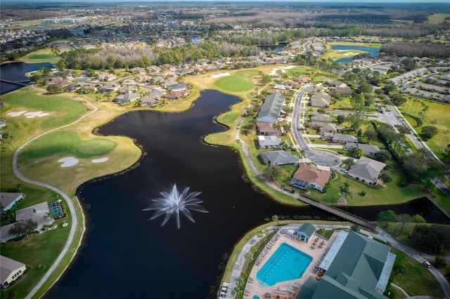 bird's eye view with a water view, view of golf course, and a residential view