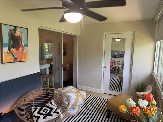 bedroom featuring ceiling fan and a closet