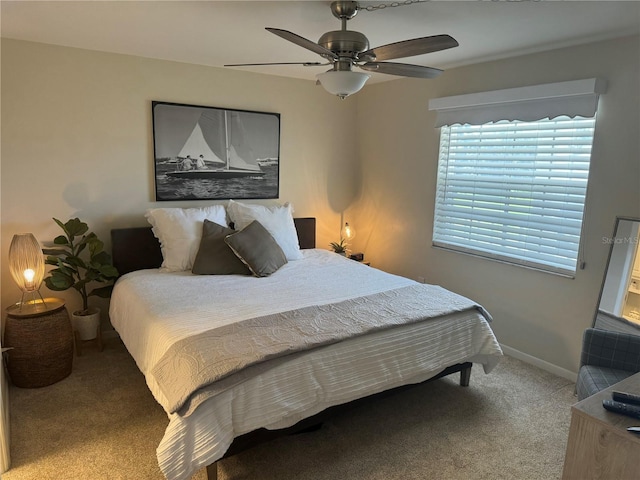 bedroom with ceiling fan and carpet