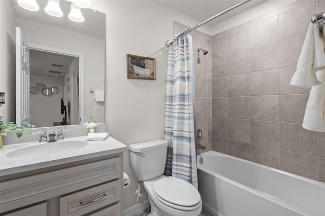 full bathroom featuring toilet, vanity, and shower / tub combo