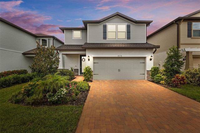 view of front of property with a garage