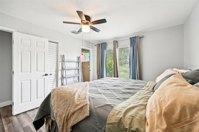 bedroom featuring ceiling fan and dark hardwood / wood-style floors